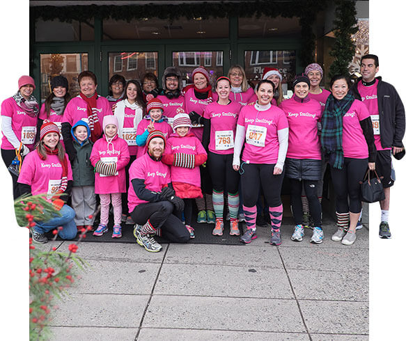 dental team in pink shirts