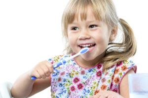 Young girl brushing teeth