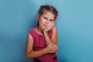 young girl with toothache