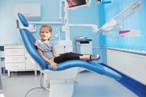 young girl in dental chair