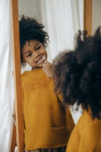 Young Girl With Electric Toothbrush